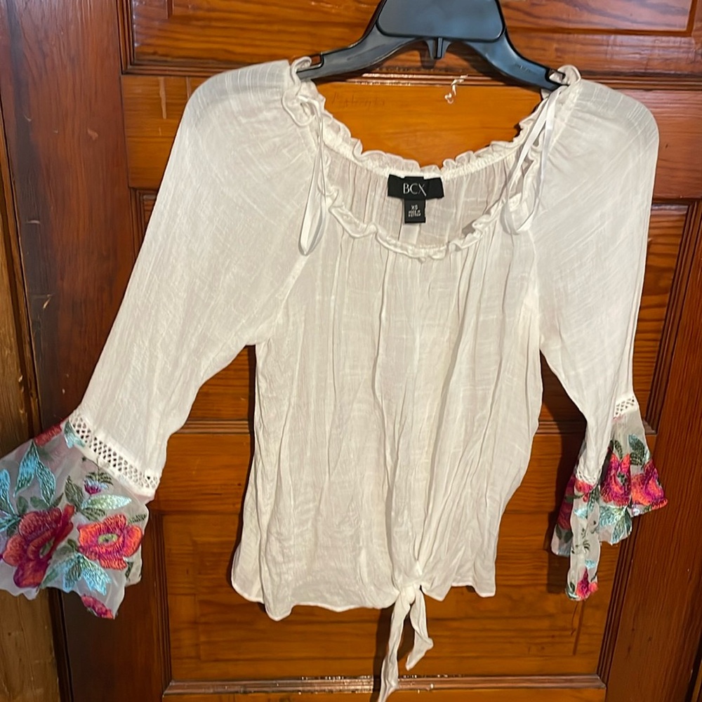 white blouse with flower detailing